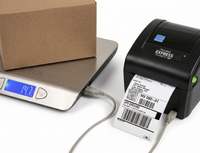 Label printer producing a label, scale with a box on it, and a UPS ground label.