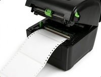 Black label printer with a roll of white labels on a white background